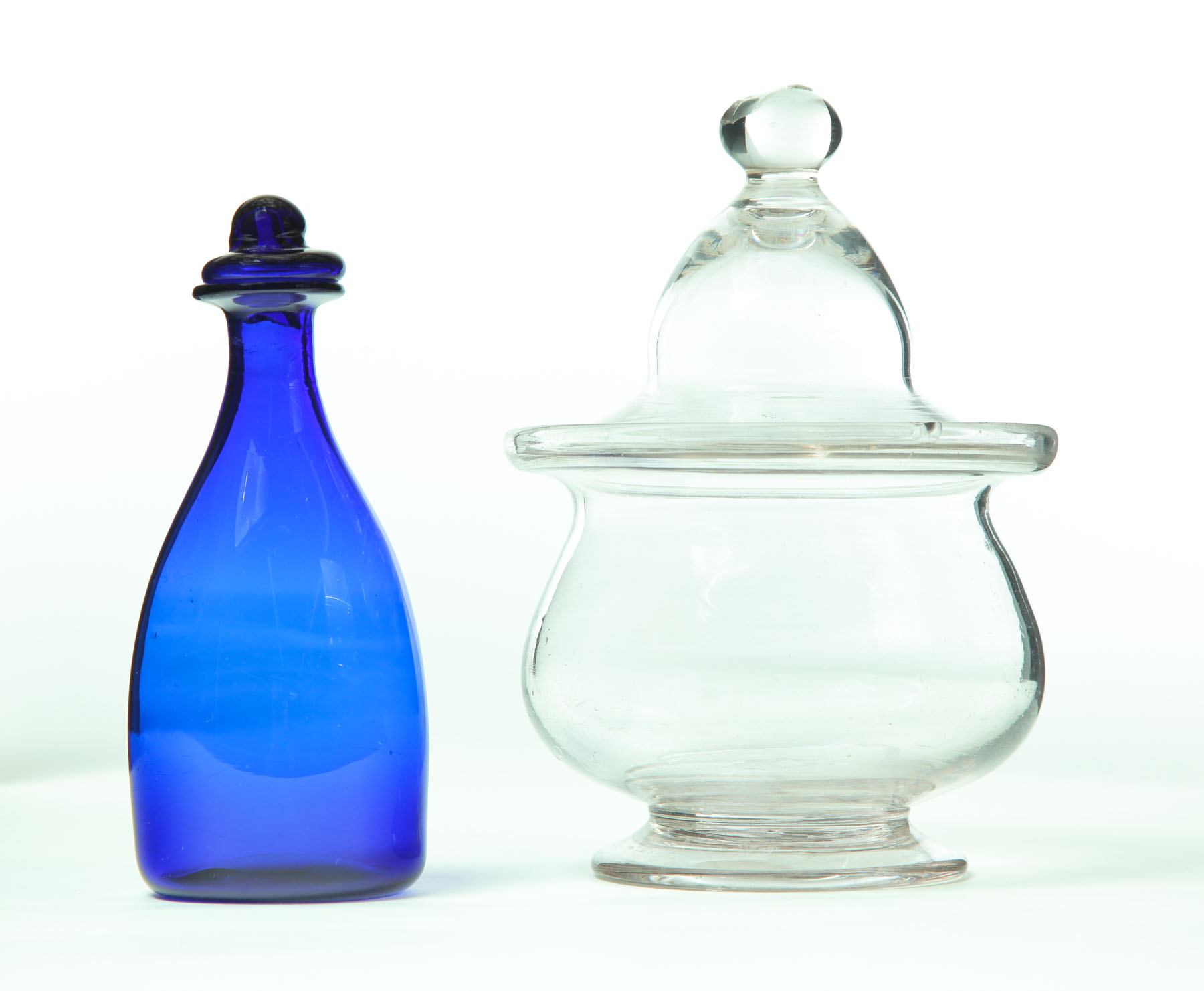 Appraisal: GLASS SUGAR BOWL AND BOTTLE Mid th century Clear blown