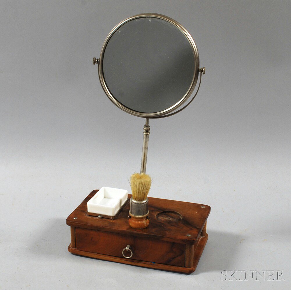 Appraisal: Walnut Shaving Stand th century mounted with a mirror brush