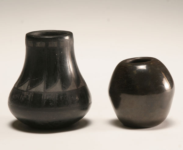 Appraisal: Santa Clara and San Ildefonso black pottery vases the larger