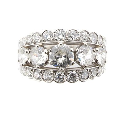 Appraisal: A diamond three row ring Set with a centre line