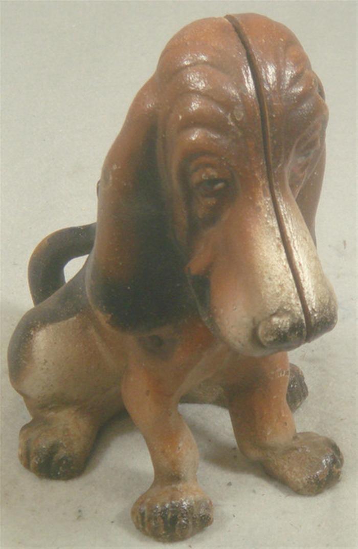 Appraisal: Cast iron doorstop free standing black and brown Bassett Hound