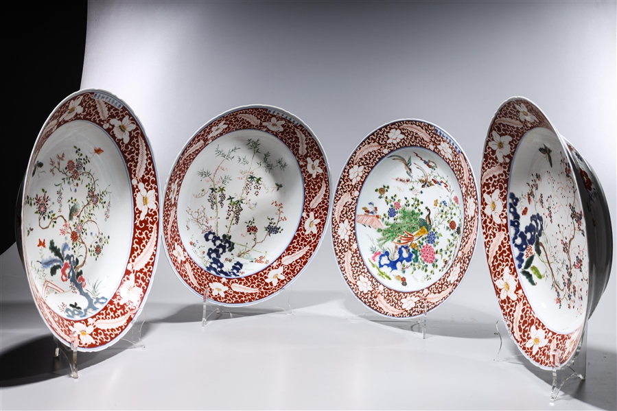 Appraisal: Set of four Chinese enameled porcelain chargers depicting blossoming trees