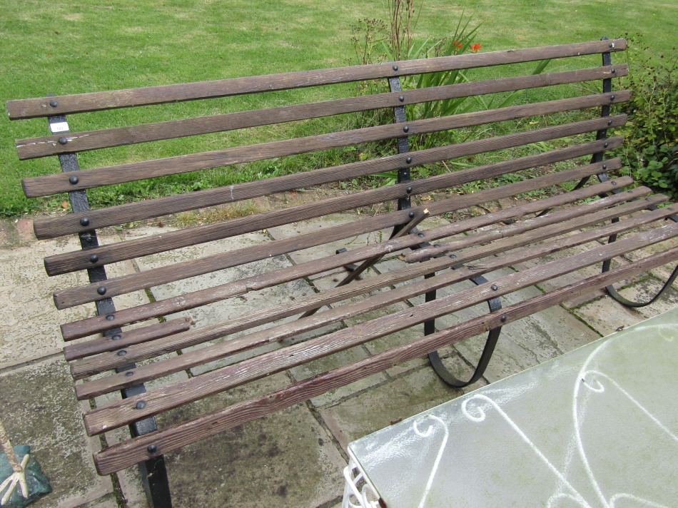 Appraisal: A Victorian style wrought iron garden bench cm one slat