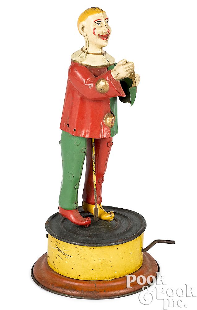 Appraisal: German tin mechanical hand crank dancing clown German painted tin