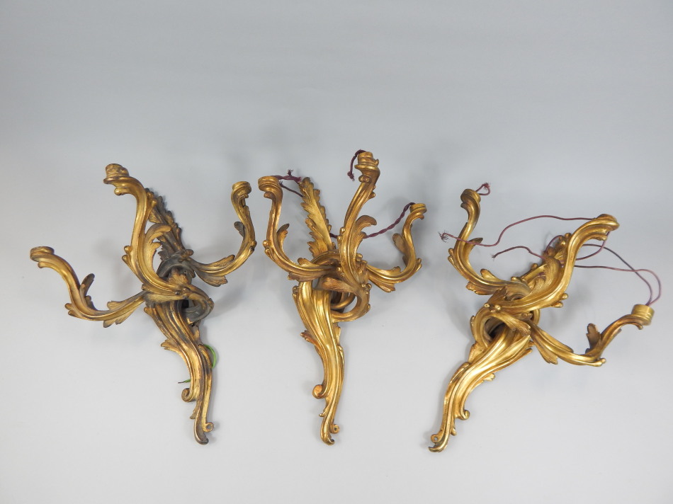 Appraisal: A set of three thC ormolu wall lights each in