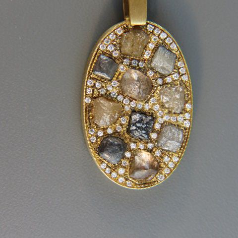 Appraisal: Diamond Pendant multi-colors of rough diamonds surrounded by round diamonds