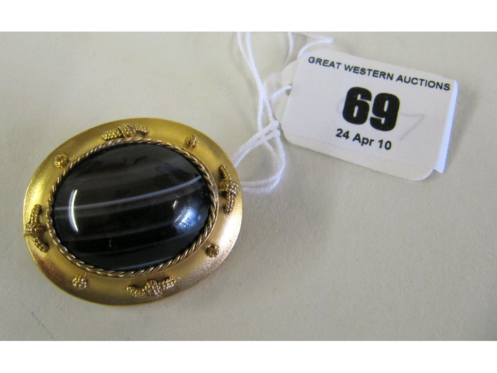 Appraisal: Victorian banded agate brooch in yellow metal mount