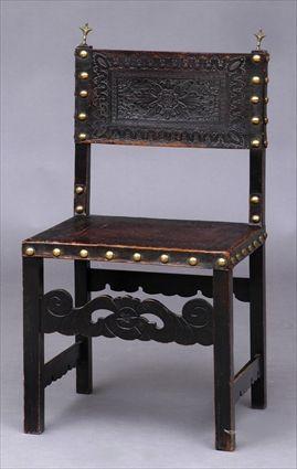 Appraisal: SPANISH BAROQUE-STYLE WALNUT AND STAMPED LEATHER SIDE CHAIR The backrest