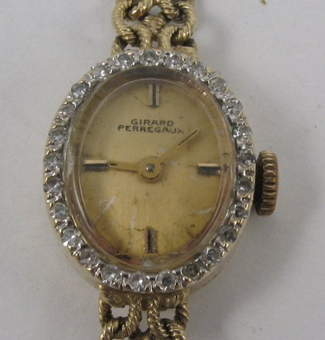 Appraisal: LADY'S DIAMOND AND FOURTEEN KARAT GOLD WRISTWATCH Girard Perregaux with