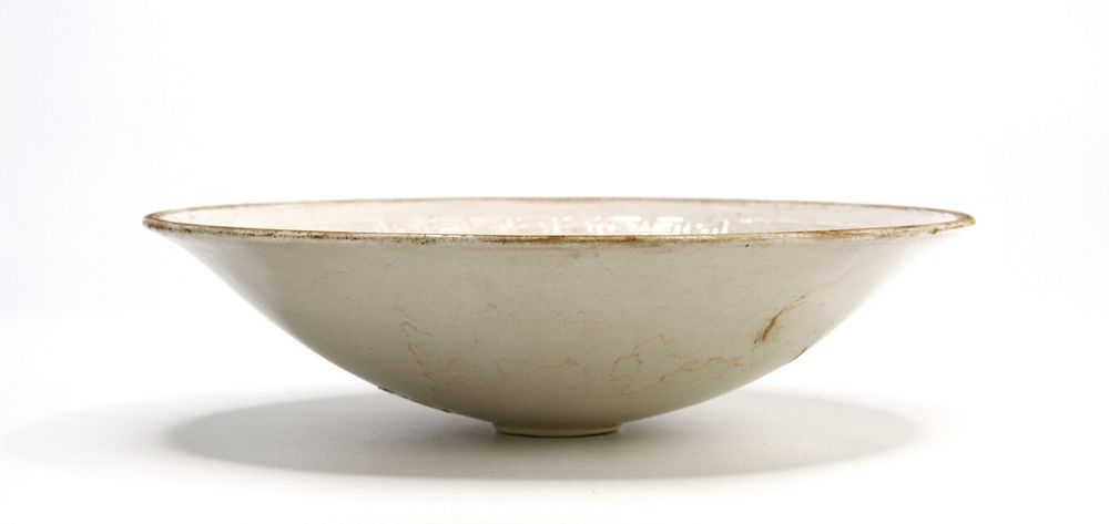 Appraisal: Moulded 'Ding' Dish Rising from a short foot the rounded