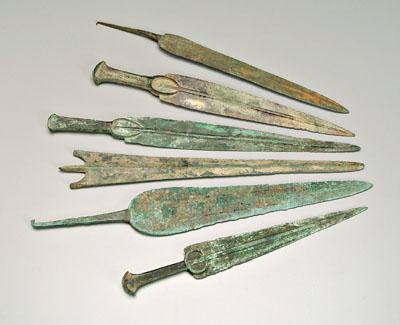 Appraisal: Six ancient bronze daggers or short swords probably Luristan probably