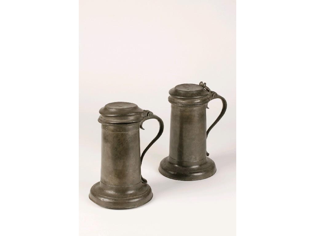 Appraisal: A PAIR OF TH CENTURY PEWTER BEEFEATER TANKARDS with flat