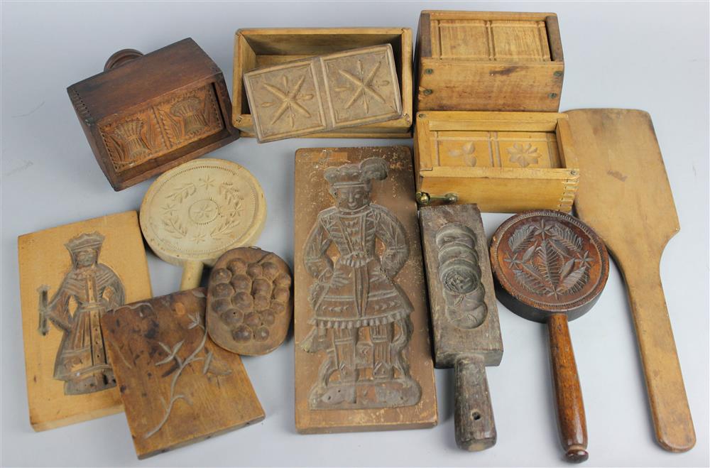 Appraisal: ELEVEN CARVED WOOD BUTTER MOLDS AND A BUTTER PADDLE including