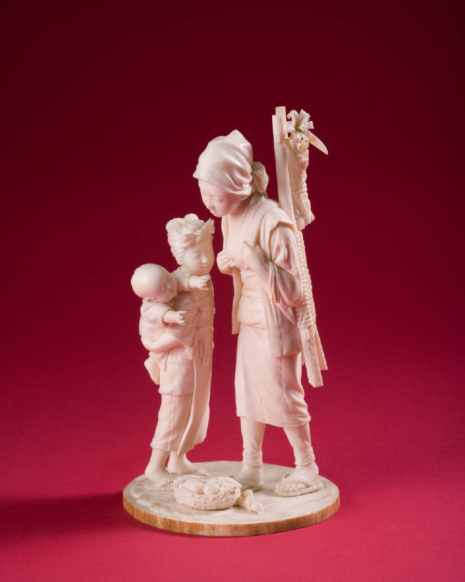 Appraisal: JAPANESE CARVED IVORY FIGURE OF A WOMAN DAUGHTER AND BABY