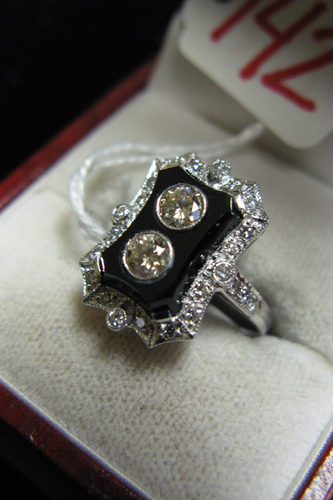 Appraisal: BLACK ONYX DIAMOND AND EIGHTEEN KARAT WHITE GOLD RING The