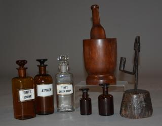 Appraisal: th C mortar and pestle five apothecary bottles and a