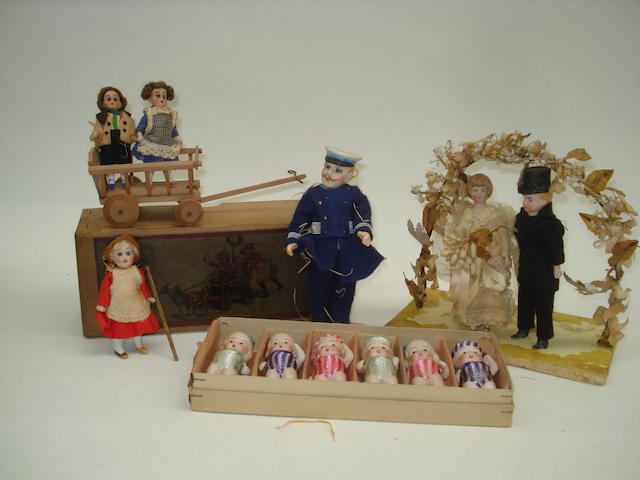 Appraisal: Boxed toy with dolls in a donkey wagon' circa Containing