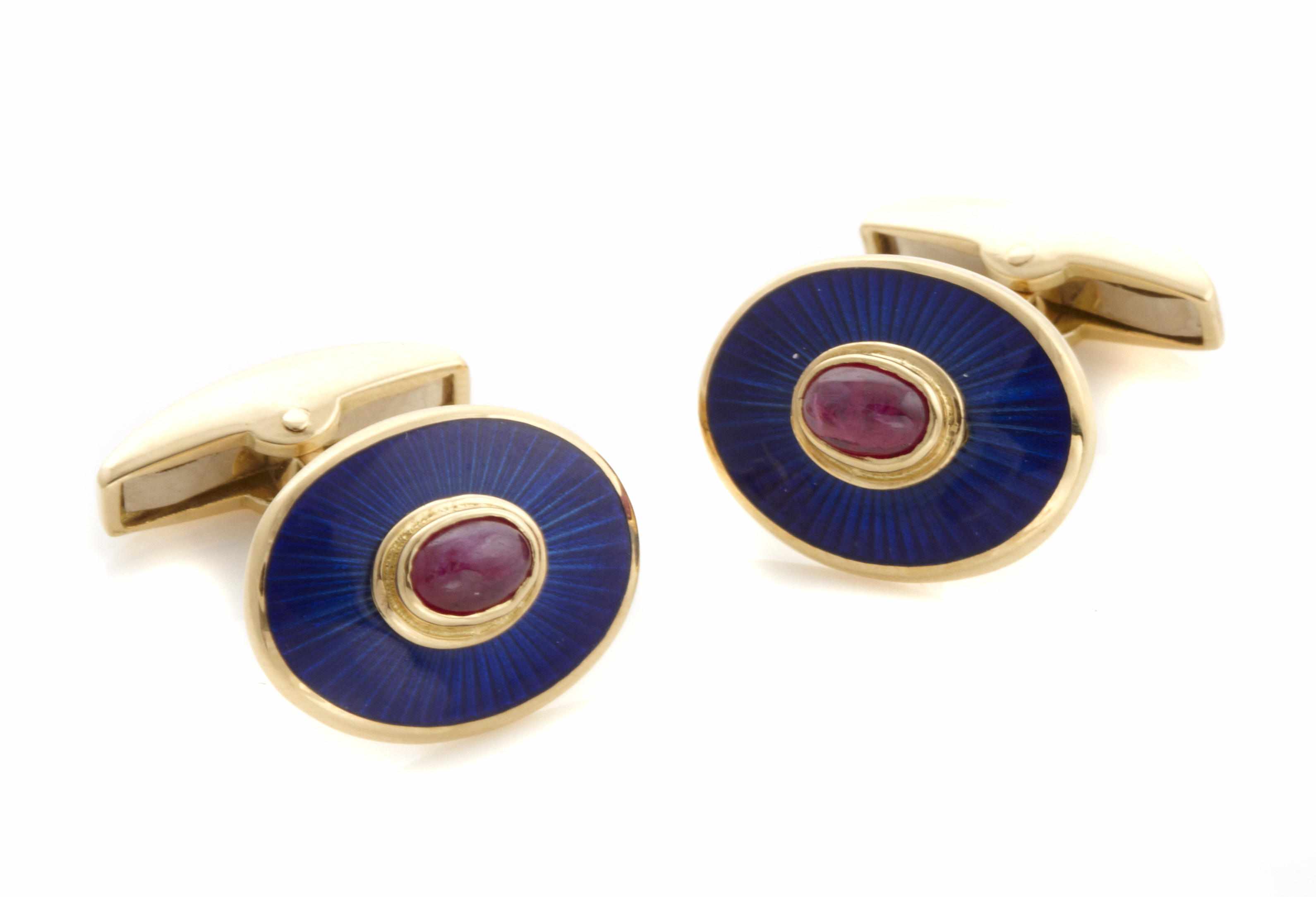 Appraisal: A pair of enamel ruby and gold cufflinks Deakin and