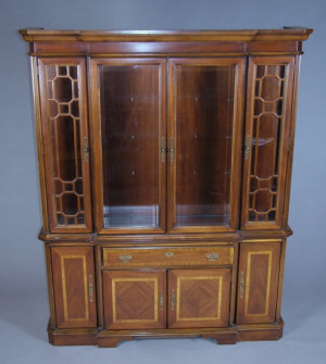 Appraisal: A mahogany breakfront bookcase late th century the centre glazed