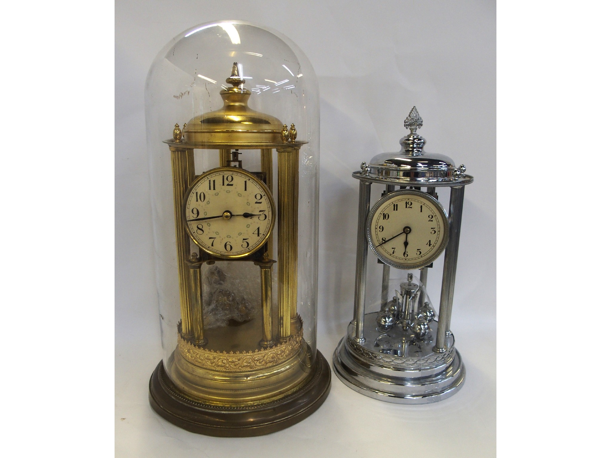 Appraisal: Gilded anniversary clock under glass dome and a chromed example