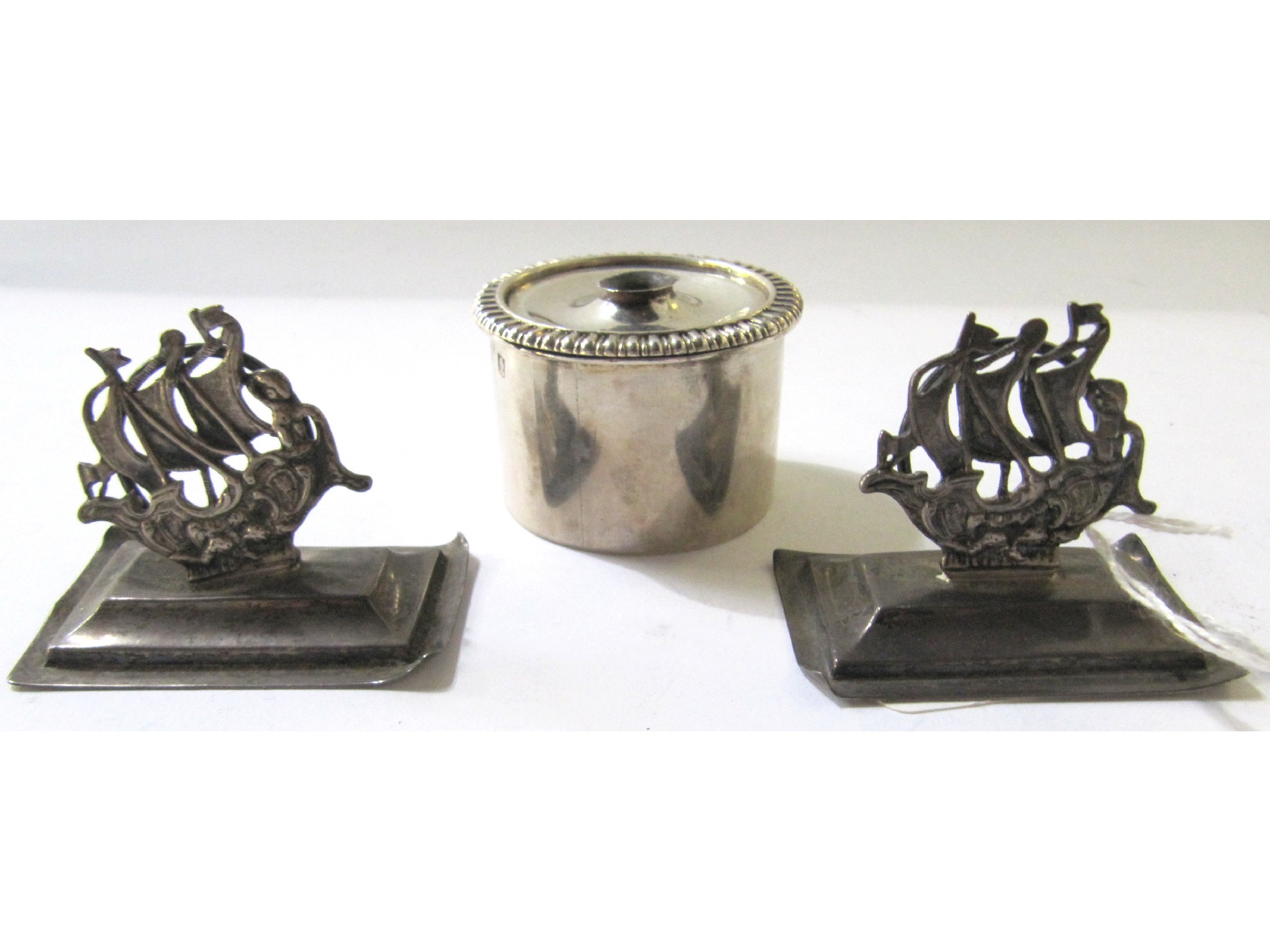 Appraisal: A lot comprising a pair of silver menu holders modelled