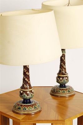 Appraisal: A pair of Doulton Lambeth stoneware candlesticks by Emily Partington