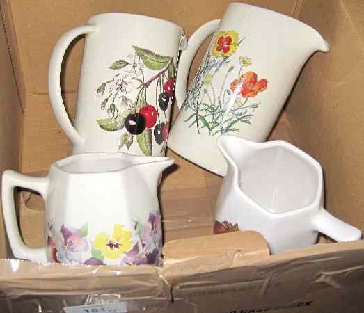 Appraisal: Wade Jugs Decorated with Various Fruit and Flower Scenes