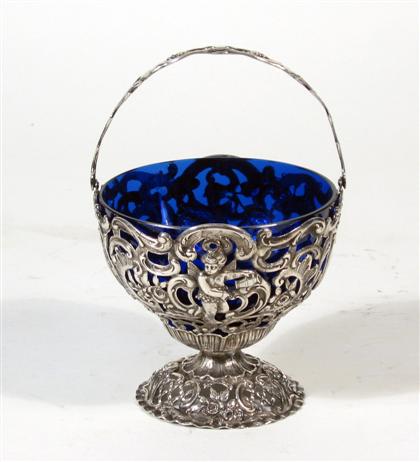 Appraisal: French silver and cobalt glass sugar basketWith a swing handle