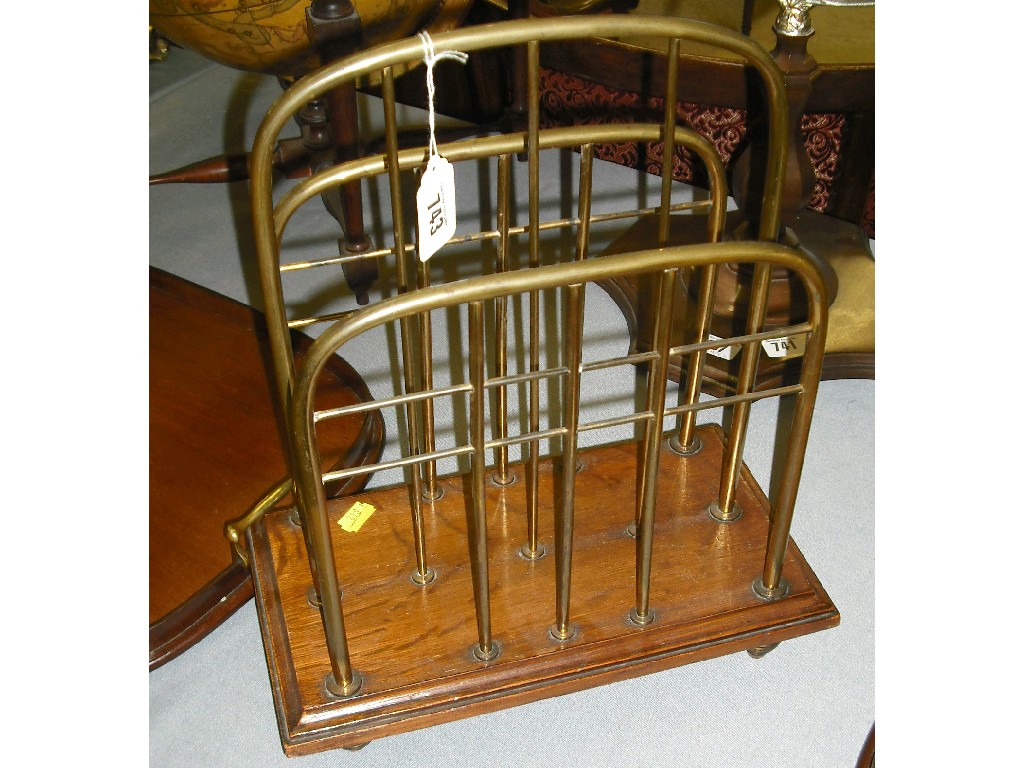 Appraisal: Edwardian oak and brass two division newspaper rack wide