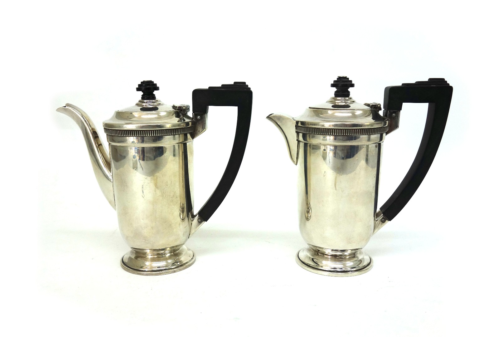 Appraisal: A pair of Art Deco silver cafe au lait pots