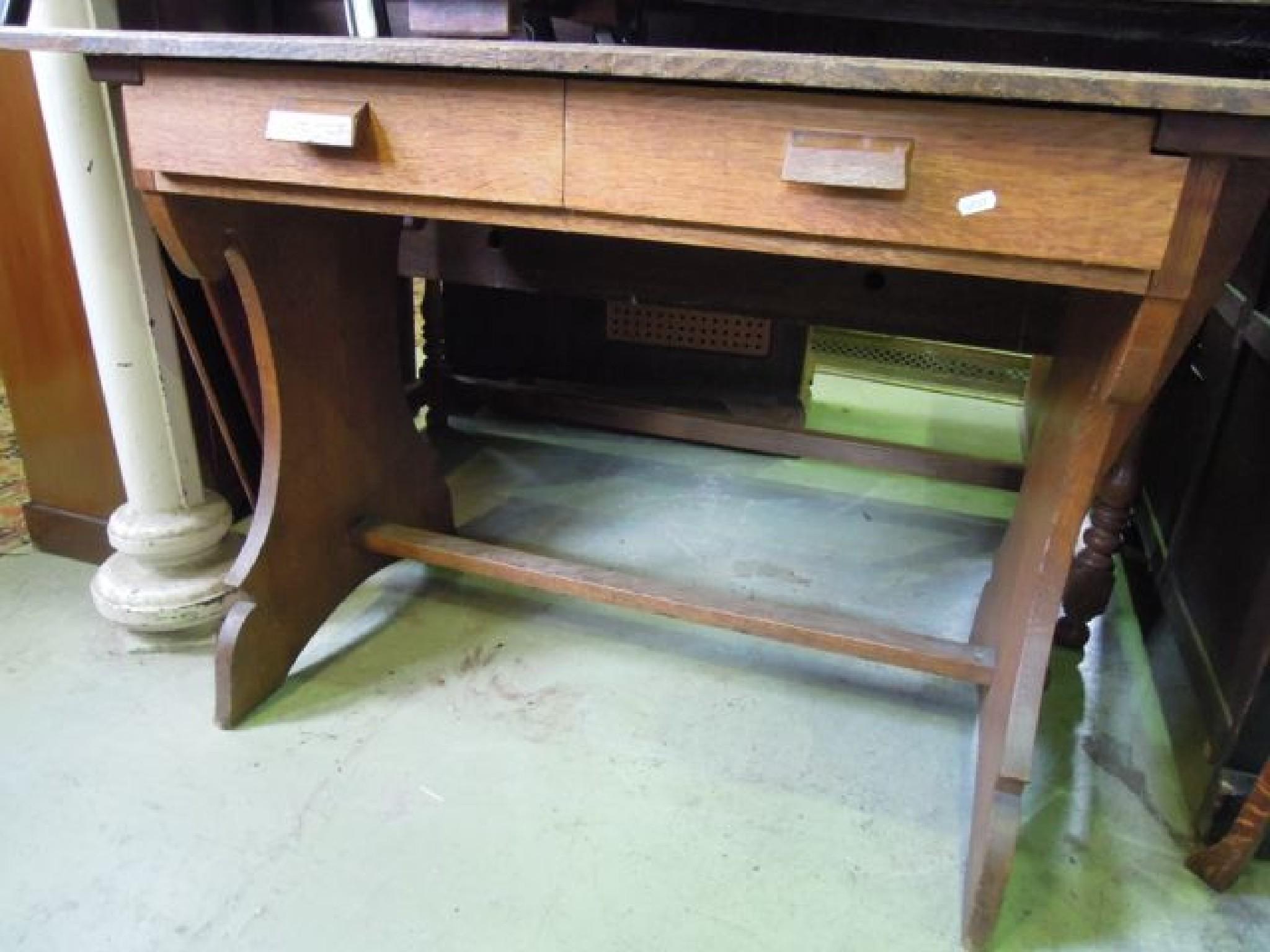 Appraisal: An Arts Crafts style oak side table fitted with two