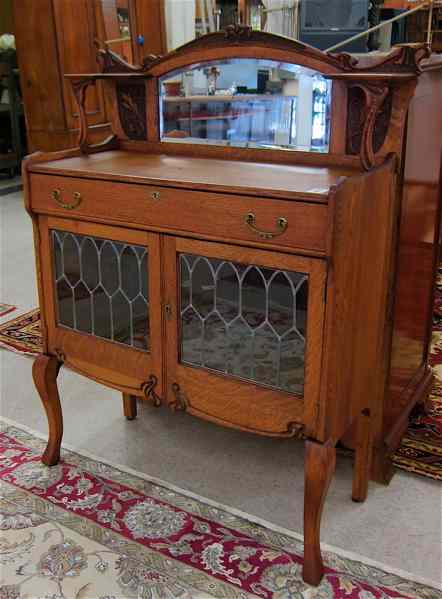 Appraisal: LATE VICTORIAN PETITE OAK CHINA BUFFET American c having a