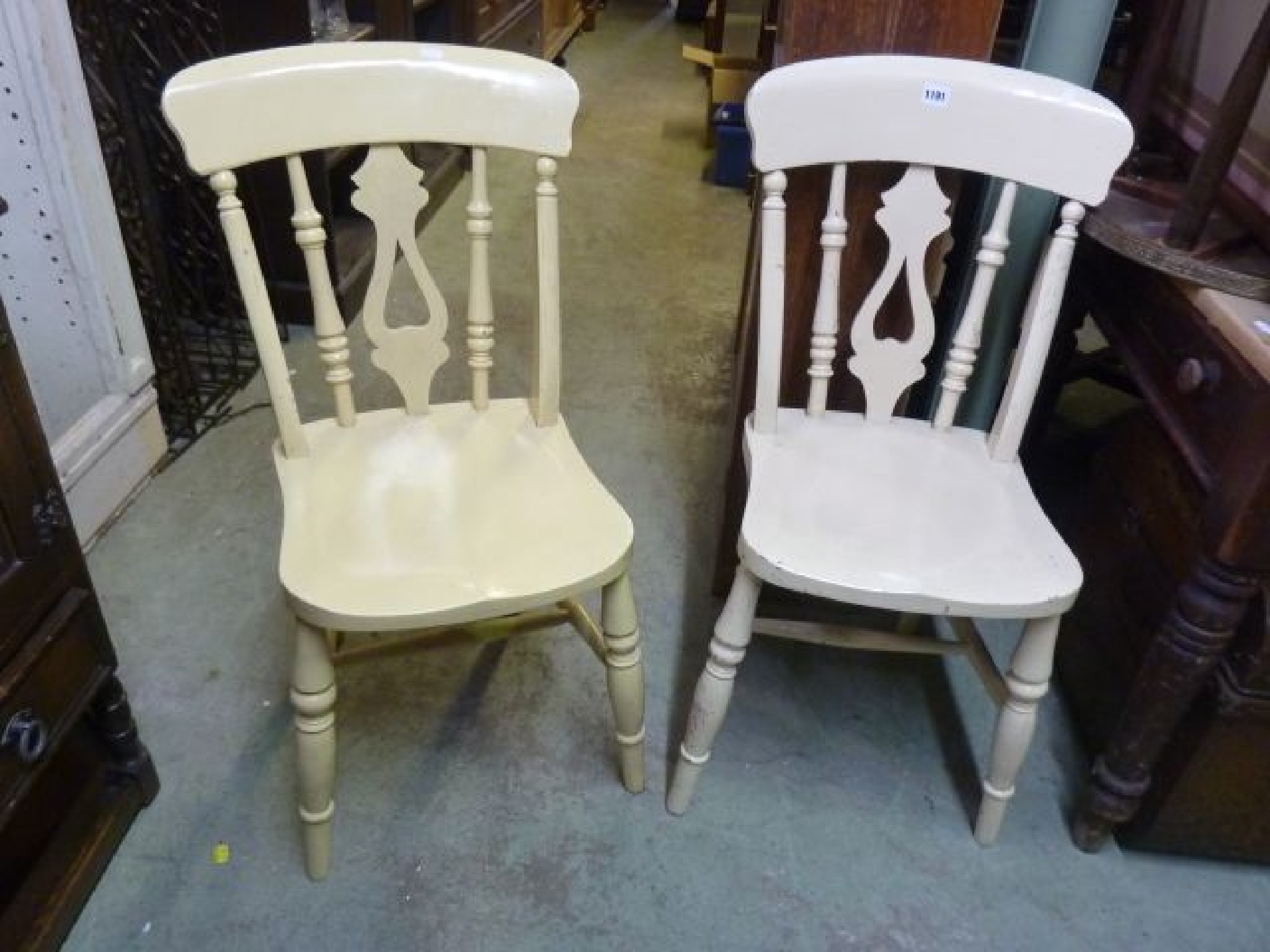 Appraisal: A pair of Victorian Windsor kitchen chairs with pierced splats