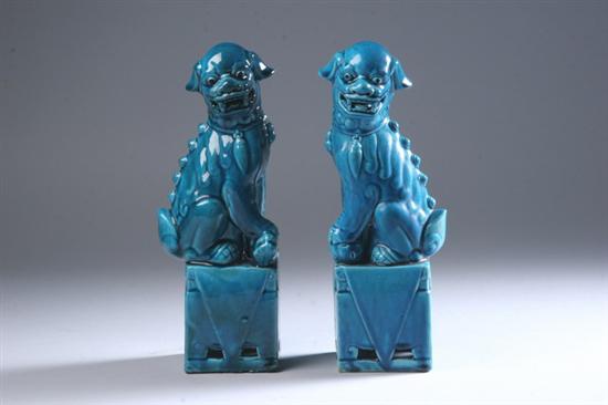 Appraisal: PAIR CHINESE TURQUOISE PORCELAIN FIGURES OF FU DOGS Qing Dynasty