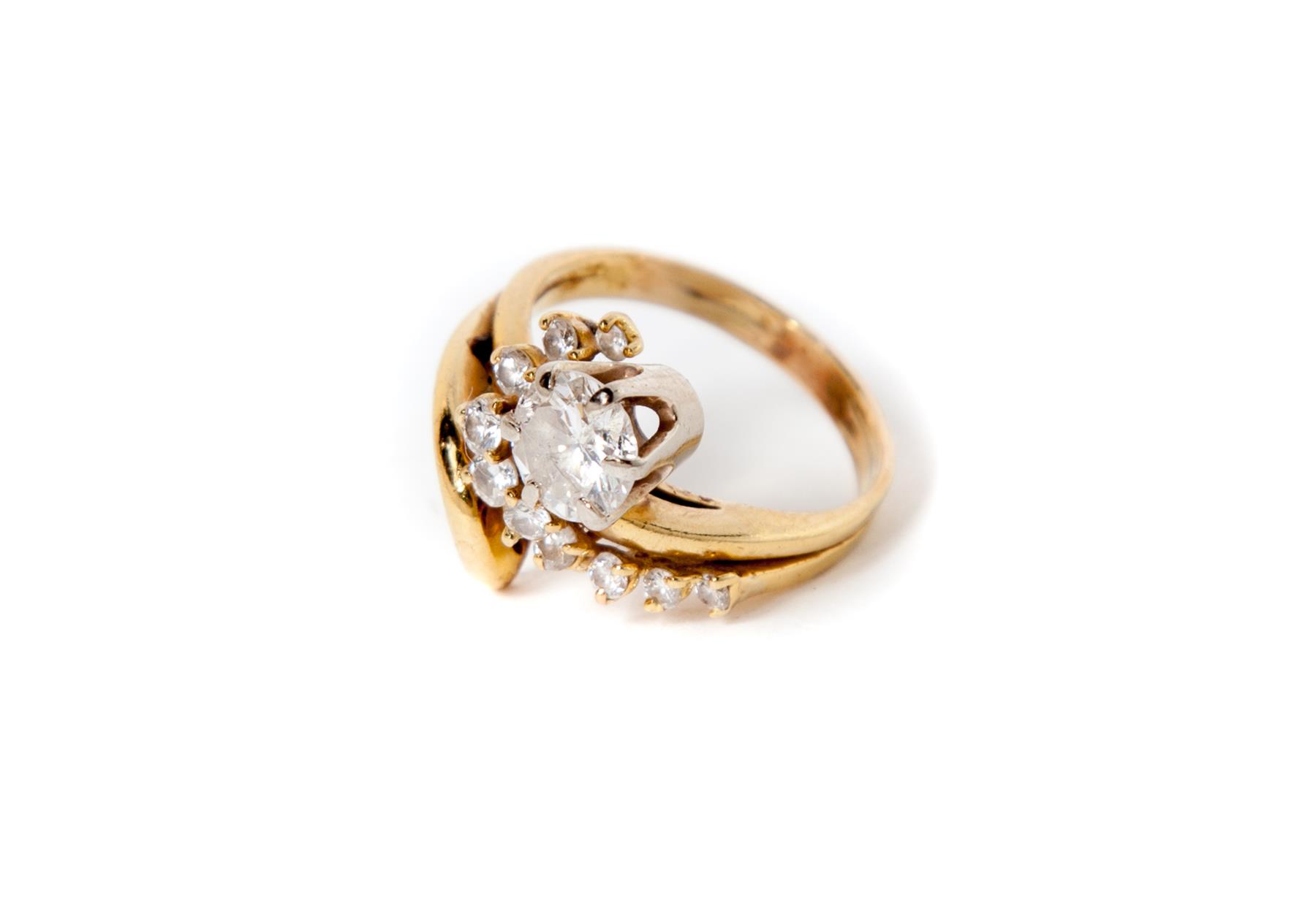 Appraisal: VINTGAGE KARAT YELLOW GOLD AND DIAMOND SWIRL RING American mid