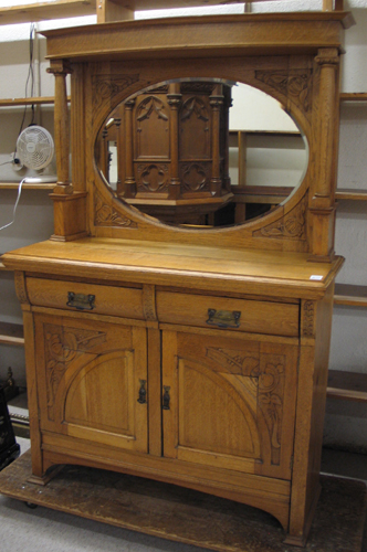 Appraisal: AN OAK SIDEBOARD English late th century having a mirror-paneled