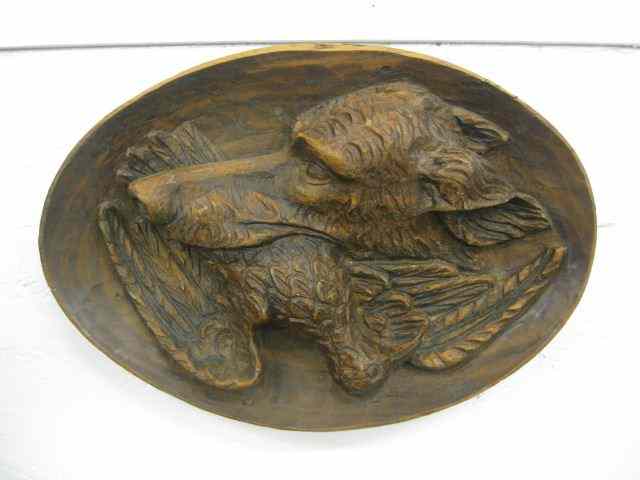 Appraisal: Victorian Wood Carving of a Retriever withduck in mouth oval