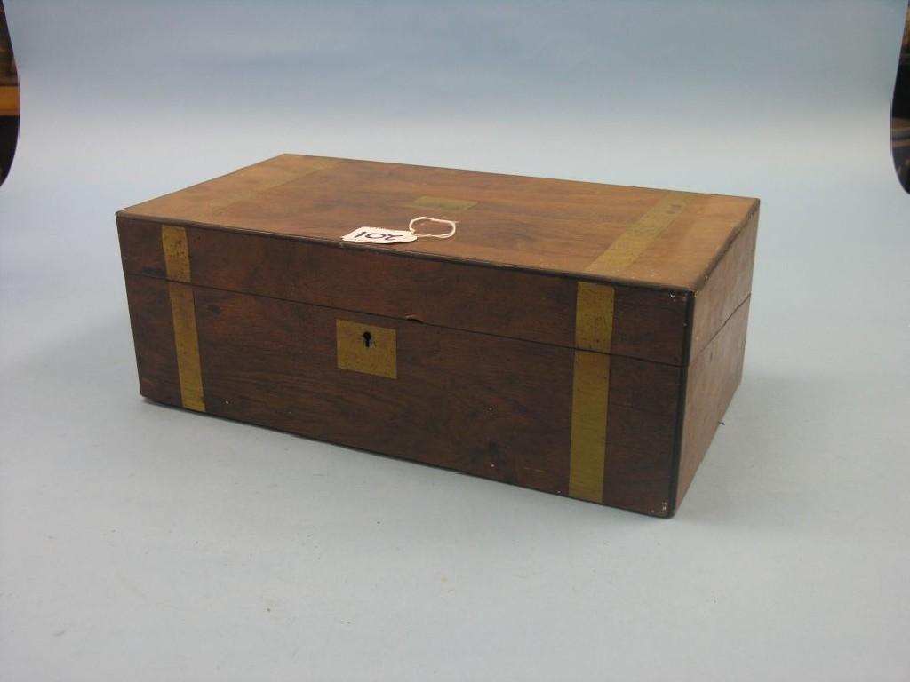 Appraisal: A Victorian walnut and brass-mounted writing box with enclosed leather