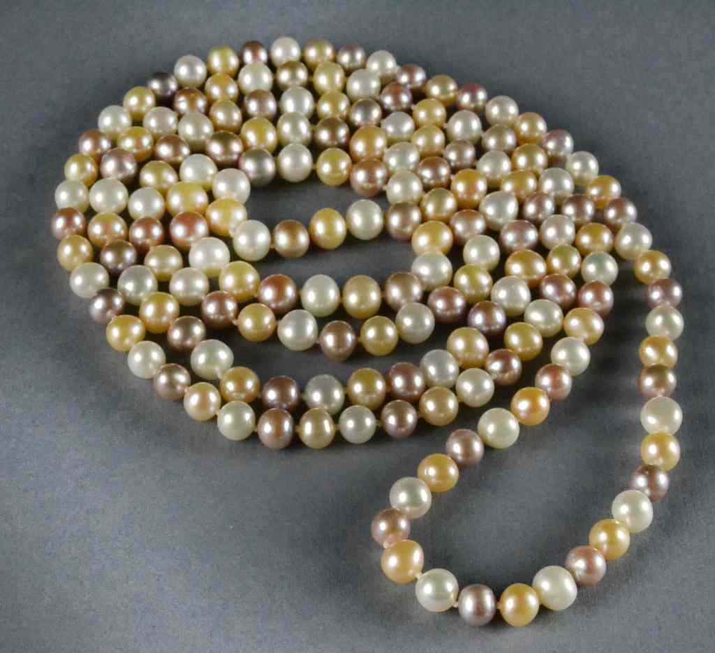 Appraisal: Multi-colored Pearl NecklaceStrand of mm pearls in white blush mauve