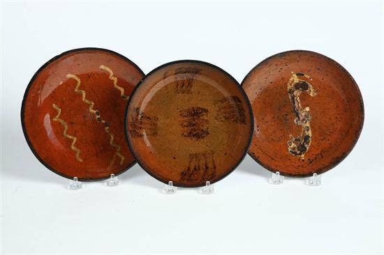 Appraisal: THREE REDWARE PIE PLATES American th century Two with coggled