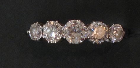 Appraisal: A HALF DIAMOND ETERNITY RING the five graduated old-cut stones