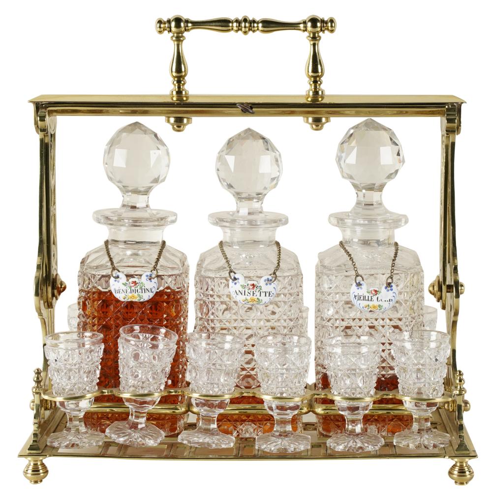 Appraisal: GILT BRASS CUT-GLASS TANTALUScomprising three decanters and twelve glasses in