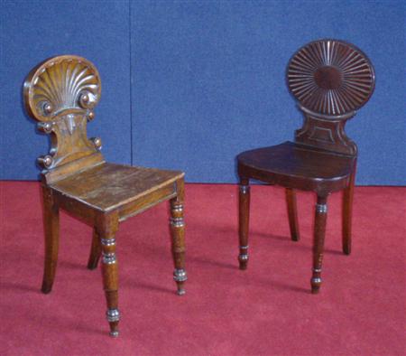 Appraisal: Two matched th century hall chairs the first oak with