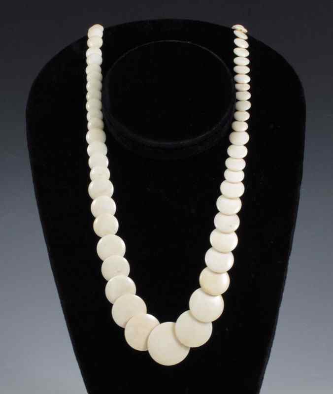 Appraisal: IVORY DISC NECKLACE '' long necklace of ivory discs The