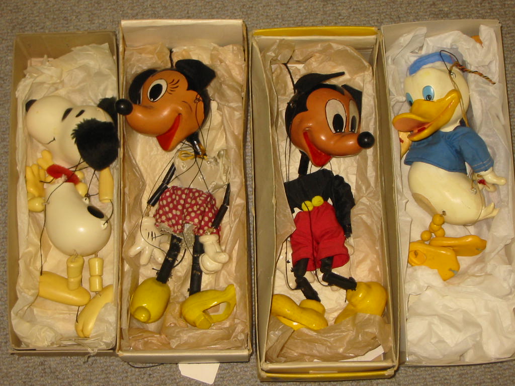 Appraisal: Four Pelham puppets comprising SL Mickey Mouse in yellow deluxe