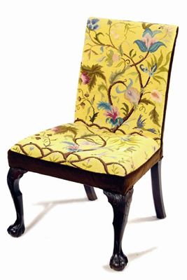 Appraisal: A side chair with a rectangular back and tapering seat