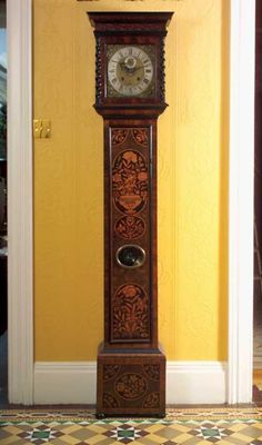 Appraisal: A late th century oyster veneered and marquetry inlaid longcase