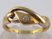 Appraisal: A yellow metal tests carat gold buckle ring set with