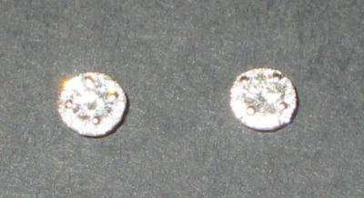 Appraisal: A PAIR OF DIAMOND STUD EARRINGS comprising a brilliant cut