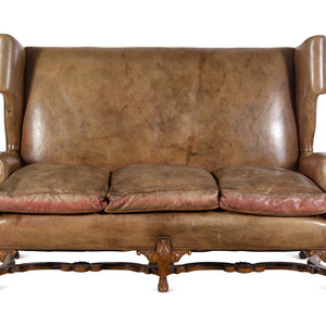 Appraisal: An English Leather-Upholstered Wingback Sofa th Century Height x width